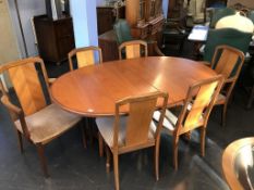 A teak oval G Plan dining table and six chairs