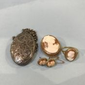 A 9ct gold, mounted cameo ring, brooch and earrings and a silver locket
