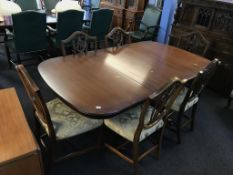 A reproduction mahogany dining table and six chairs