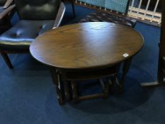 An Old Charm oak oval nest of tables