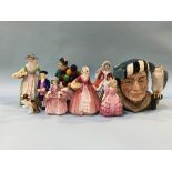 Seven Royal Doulton figures, a character jug and a cat (9)