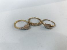 Two 9ct gold rings, 3.5g, and an 18ct gold ring, 2.6g