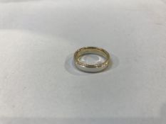A 9ct gold two colour wedding ring