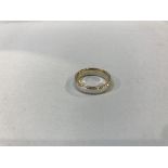 A 9ct gold two colour wedding ring