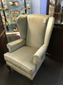 A wing armchair (as new)
