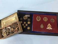 A collection of cap badges etc. (40plus)