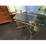 A pair of glass top metalwork tables