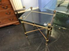 A pair of glass top metalwork tables