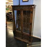 An Old Charm oak leaded glass bookcase, 88cm wide