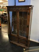 An Old Charm oak leaded glass bookcase, 88cm wide