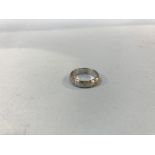 A platinum brushed diamond set wedding ring