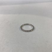 A 9ct gold, white diamond, half eternity ring