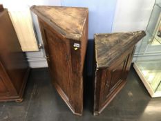 Two small oak corner cabinets