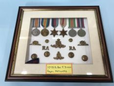 A cased set of World War II medals and badges, to 107513 GNR, J. Dixon RA