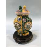 A Chinese lidded vase, decorated in two halves, signed in underglaze red, 18cm height
