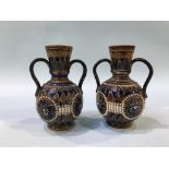 A pair of Doulton Lambeth two handled vases, 16cm height