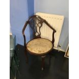 An Edwardian mahogany corner chair