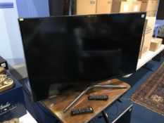 A Samsung TV, with remote