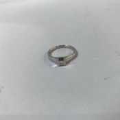 An 18ct gold, rim set single Princess cut diamond ring