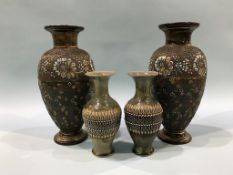 A pair of Doulton Lambeth Slaters Patent vases and a smaller pair of stoneware vases, 36cm height