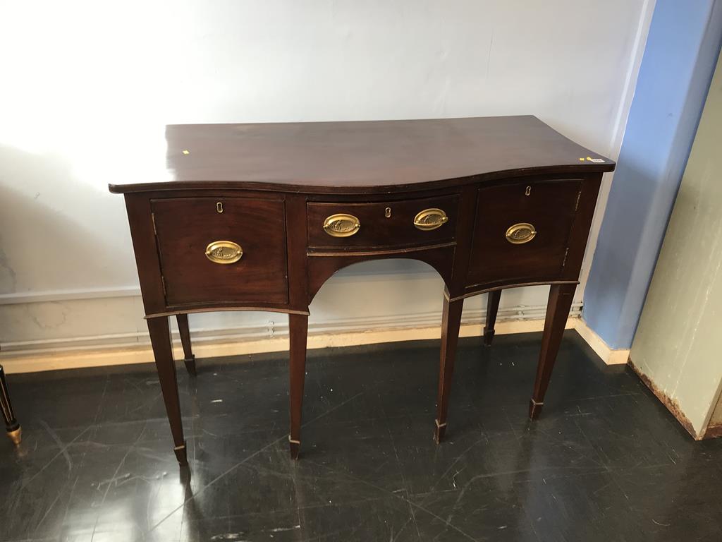 A small late 19th century mahogany serpentine sideboard