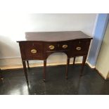 A small late 19th century mahogany serpentine sideboard