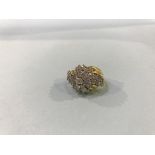 An unmarked yellow metal, 18ct?, diamond cluster ring, 13.5g, size 'N'