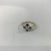 A 9ct gold, pear shape sapphire and diamond cluster ring