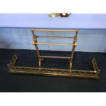 A brass fender and a towel rail
