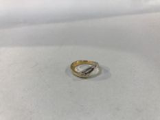 An 18ct gold, yellow and white diamond set wishbone ring