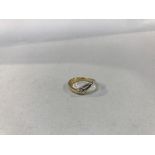 An 18ct gold, yellow and white diamond set wishbone ring