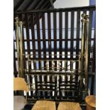 An ornate brass three quarter bed frame