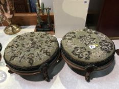 A pair of Victorian walnut circular and beadwork footstools, 31cm diameter