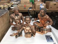 Three copper effect musical busts