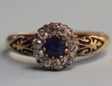 An 18ct gold diamond and sapphire ring, 3.8g, size 'P'