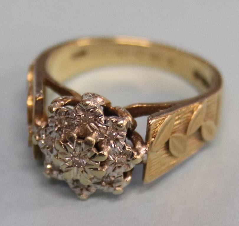 A 9ct gold, nine diamond cluster ring, size 'N'