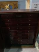 A modern nine drawer collectors cabinet, 51cm wide, 28cm deep, 63cm high