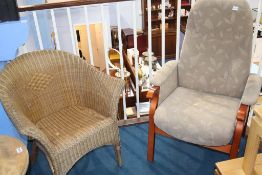 A recliner armchair and wicker chair