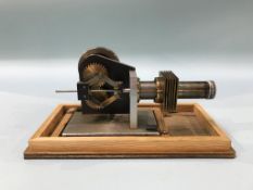 A cased model of a Rhombic Drive Stirling engine, 23cm wide