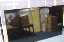 A boxed Samsung 7 Series 75" TV