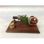 A small cased model of a 'Stirling Engine', 15cm wide