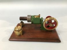 A small cased model of a 'Stirling Engine', 15cm wide