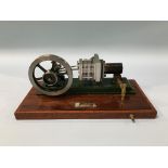 A cased model of a 'Stirling Engine', 27cm wide