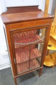 An Edwardian china cabinet