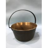 A brass jam pan