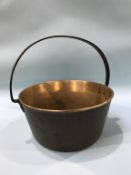 A brass jam pan