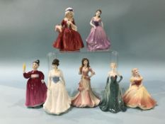 A selection of Doulton and Coalport figures