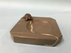 A marble effect ashtray, mounted with a cast metal tortoise