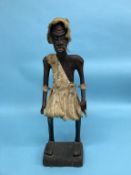 A tall carved tribal figure, purchased in a market in Kitwe, Zambia, 70cm height