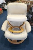 An Ekorness Stressless cream leather armchair and footstool